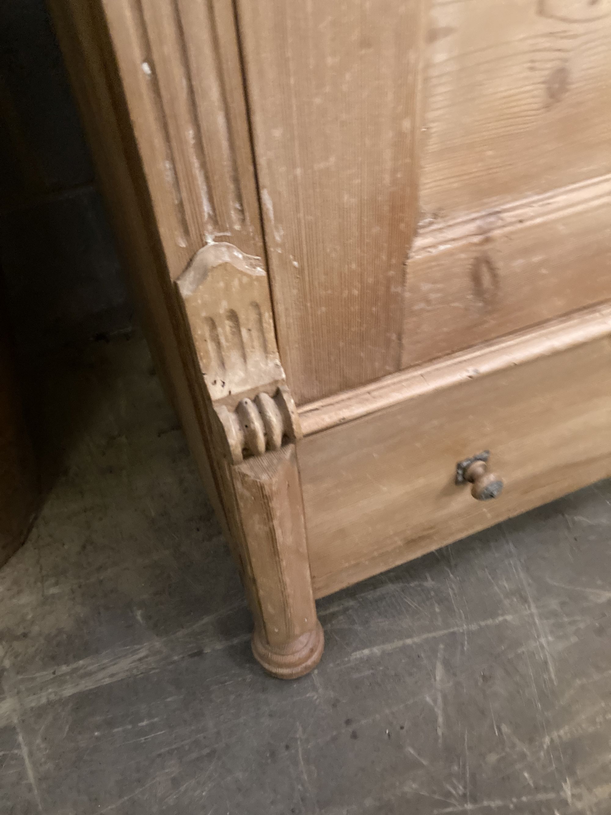 A pine display cabinet, fitted single glazed door enclosing four shelves over base drawer, width 100cm, depth 55cm, height 183cm